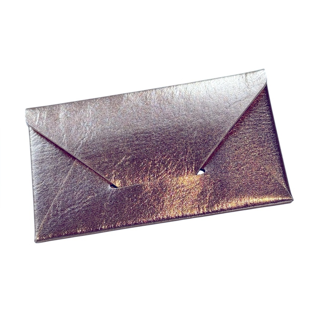 Slim envelope style card case in pink shimmer. NWOT. Never Used.